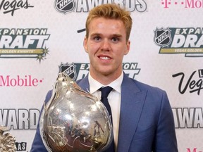 Connor McDavid of the Edmonton Oilers poses with the Hart Trophy in 2017. He also won the Hart in 2021 and is a favourite to take the trophy in the 2021-22 NHL season.