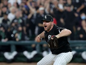 Relief pitcher Liam Hendriks (31) of the Chicago White Sox reacts after a win over the Houston Astros in Game 3 of the American League Division Series at Guaranteed Rate Field on October 10, 2021 in Chicago.