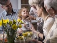 Three-generation family enjoying dinner