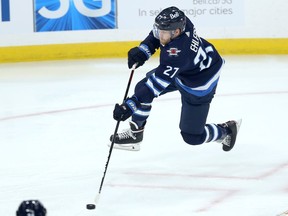 Winnipeg Jets forward Nikolaj Ehlers jumps into his shot against the Anaheim Ducks in Winnipeg on Thursday, Oct. 21, 2021.