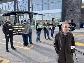 University of Manitoba Faculty Association Vice-President and University of Manitoba history instructor Erik Thomson speaks with media on Saturday about a labour dispute between UMFA and the University of Manitoba outside the Victoria Inn in Winnipeg where the Manitoba Progressive Conservatives were choosing Manitoba’s next premier between Heather Stefanson and Shelly Glover. The University of Manitoba Faculty Association has set a bargaining deadline of midnight Sunday and continues to bargain with the University administration throughout the weekend. A strike deadline has been set for Tuesday.