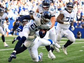 Derrick Henry of the Tennessee Titans carries the ball against the Indianapolis Colts.