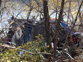 One of approximately 12 homeless encampment sites on a 200m stretch of Waterfront Drive on Thursday.   James Snell/Winnipeg Sun