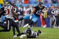 Nick Westbrook-Ikhine of the Tennessee Titans falls over a Houston Texans defender.