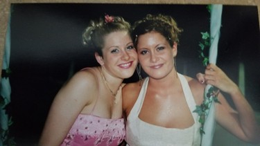 Amber McFarland (left) and her twin sister Ashley pose for a picture at their high school graduation. Amber McFarland was just 24 years old when she was last seen by friends at a night club in Portage la Prairie at around 1 a.m. on Oct. 18, 2008.