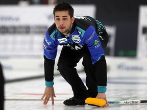 Third Colton Lott watches his shot during the 2020 provincial men's curling championship at Eric Coy Arena in Winnipeg on Wed., Feb. 5, 2020.