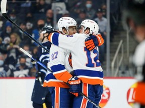 New York Islanders forward Anders Lee celebrates with Josh Bailey after scoring a goal against the Winnipeg Jets at Canada Life Centre. The Jets lost 2-0.  USA TODAY Sports
