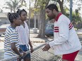 Demi Singleton as Serena Williams, Saniyya Sidney as Venus Williams and Will Smith as Richard Williams in the biopic 'King Richard'.