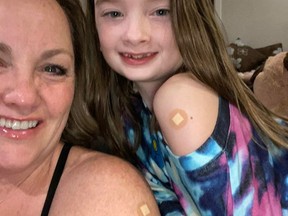 Patti Lytwyn is seen with her daughter after they both got flu shots back in November. Lytwyn said her daughter has now been booked for a COVID-19 vaccine, and will go for the shot in early December. Handout photo