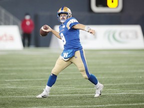 Winnipeg Blue Bombers quarterback Zach Collaros (8) looks to pass the ball against the Montreal Alouettes during the third quarter during a Canadian football League game at IG Field in Winnipeg on Nov. 6, 2021. Winnipeg Blue Bombers defeat Montreal Alouettes 31-21.