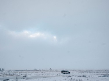 A polar bear tour van is seen along a road near the community of Churchill, Man., on Nov. 22, 2021.