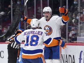 New York Islanders forward Brock Nelson (29) reacts with teammate forward Anthony Beauvillier (18) after scoring a goal against the Montreal Canadiens during the second period at the Bell Centre in Montreal on Nov. 4, 2021.