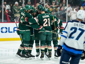 Minnesota Wild defenseman Alex Goligoski (47) celebrates his goal with teammates during the first period against the Winnipeg Jets at Xcel Energy Center in Saint Paul, Minn., on Nov 26, 2021.