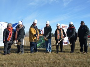 Manitoba Métis Federation president David Chartrand (third from left) is joined by The Pas Mayor Herb Jaques (fourth from left) and others in The Pas on Tuesday for a ground breaking, and to announce that MMF was investing $10 million dollars into a brand new facility that would include new affordable seniors housing and a day care center.
