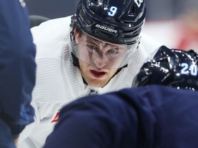 Andrew Copp (left) lines up for a face-off against Riley Nash during Winnipeg Jets practice at Canada Life Centre on Monday, Nov. 1, 2021.