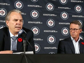 Winnipeg Jets chairman Mark Chipman (right) listens as general manager Kevin Cheveldayoff addresses his role in the Kyle Beach scandal during a press conference at Canada Life Centre on Tuesday, Nov. 2, 2021.