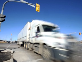 A truck goes through the intersection of Kenaston and McGillivray Boulevards in Winnipeg on Monday, Nov. 8, 2021. It is considered the most dangerous intersection in Winnipeg for total collisions for 2016-2020.