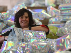 Shawna Bell, Executive Director of the Winnipeg Christmas Cheer Board with gifts in Winnipeg on Friday Nov. 12, 2021.Shawna Bell, Executive Director of the Winnipeg Christmas Cheer Board with gifts in Winnipeg on Friday Nov. 12, 2021.