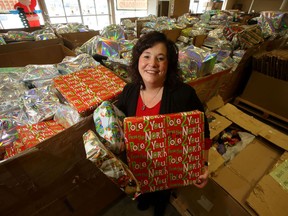 Shawna Bell, Executive Director of the Winnipeg Christmas Cheer Board with gifts in Winnipeg on Friday Nov. 12, 2021.