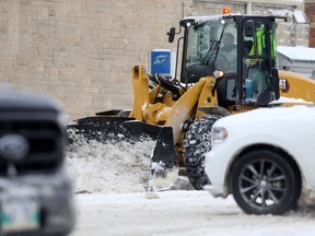 Snow clearing equipment on a street in Winnipeg on Friday Nov. 12, 2021.