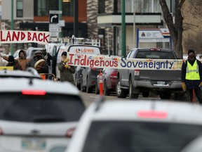 Members of the Manitoba Energy Justice Coalition briefly blocked traffic on Portage Avenue in front of RCMP headquarters in Winnipeg.  The group was acting in solidarity with Wet'suwet'en land defenders currently blocking a pipeline project in British Columbia on Friday Nov. 19. 2021 Chris Procaylo/Winnipeg Sun