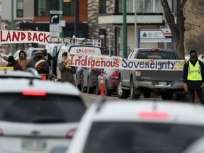 Members of the Manitoba Energy Justice Coalition briefly blocked traffic on Portage Avenue in front of RCMP headquarters in Winnipeg.  The group was acting in solidarity with Wet'suwet'en land defenders currently blocking a pipeline project in British Columbia.  Chris Procaylo,  Friday Nov. 19. 2021 Winnipeg Sun