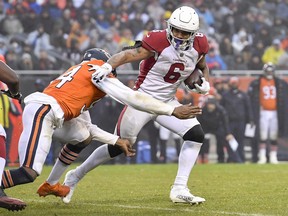Arizona Cardinals running back James Conner runs with the football against the Chicago Bears.