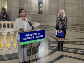 Health Minister Audrey Gordon speaks to media at the Manitoba Legislature on Wednesday Dec. 1, 2021 regarding new services offered by pharmacists in Manitoba. Background Catherine Cox, the minister responsible for the status of women.  James Snell/Winnipeg Sun