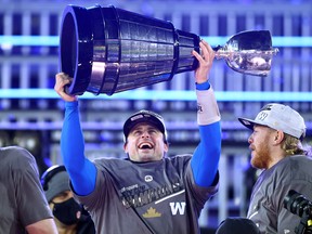 Zach Collaros of the Winnipeg Blue Bombers celebrate their victory with the Grey Cup following the 108th Grey Cup CFL Championship Game against the Hamilton Tiger-Cats at Tim Hortons Field on Dec. 12, 2021 in Hamilton.