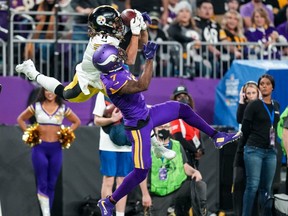 Pittsburgh Steelers wide receiver Chase Claypool (11) catches a pass over Minnesota Vikings cornerback Patrick Peterson (7) during the third quarter at U.S. Bank Stadium. A Manitoba woman’s curse could be the cause of Minnesota’s futility. Brace Hemmelgarn-USA TODAY Sports