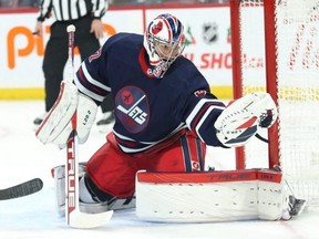 Jets goalie Connor Hellebuyck feels players could be given the relevant information and make their own decisions.