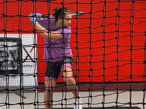 Blue Jays’ Bo Bichette takes his cuts in the batting cage in Clearwater, Fla., on Tuesday. He is there working out with Teoscar Hernandez and Danny Jansen.