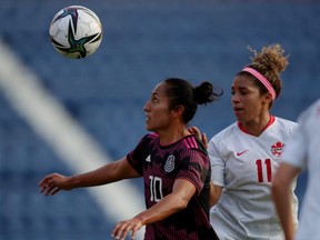 Mexico's Stephany Mayor in action with Canada's Desiree Scott in a game between Canada and Mexico at the Estadio Azulgrana on Nov. 30, 2021.