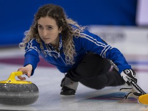 Skip Mackenzie Zacharias delivers a rock during her game against Team Canada as the Scotties Tournament of Hearts began Feb. 19, 2021, in Calgary.