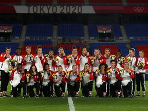 Gold medallists Canada pose during the medal ceremony at the Olympic Stadium in Tokyo, Japan on August 6, 2021.