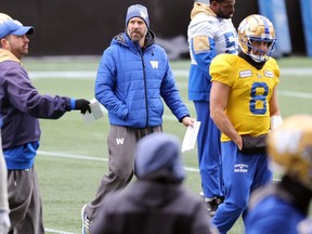 Offensive co-ordinator Buck Pierce (centre) on the field during Winnipeg Blue Bombers practice yesterday.  The Bombers offensive line will be in a tough battle against Riders defensive line on Sunday.