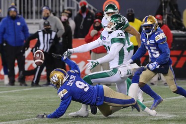 Winnipeg Blue Bombers DB Nick Taylor (left) breaks up a pass intended for Saskatchewan Roughriders WR Mitchell Picton to sew up the CFL West Final in Winnipeg on Sun., Dec. 5, 2021.  KEVIN KING/Winnipeg Sun/Postmedia Network