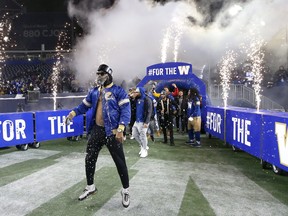 Rasheed Bailey (left) leads the receivers out on to IG Field as the Winnipeg Blue Bombers celebrated their 2021 Grey Cup win on Wed., Dec. 15, 2021.