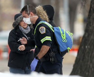 A paramedic wears a mask and gloves while on duty in Winnipeg on Nov. 19. Chris Procaylo/Winnipeg Sun