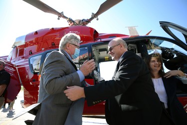 Premier Kelvin Goertzen (centre), with wife Kimberley Hiebert (right) during an event to introduce a new Airbus H145 helicopter to the STARS air ambulance fleet, at its Winnipeg base on West Hangar Road, on Mon., Sept. 6, 2021. KEVIN KING/Winnipeg Sun/Postmedia Network