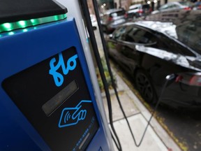 A Flo electric vehicle charging station is seen as a car charges in Manhattan, New York, U.S., December 7, 2021.