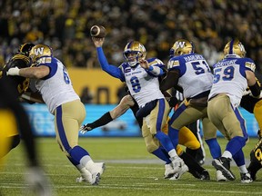 Winnipeg Blue Bombers quarterback Zach Collaros (8) throws a pass during the 108th Grey Cup football game at Tim Hortons Field in Hamilton on Dec. 12, 2021.