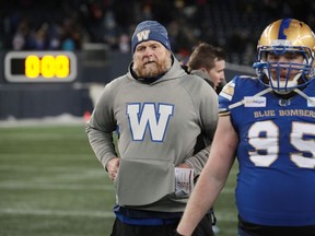 Winnipeg Blue Bombers head coach Mike O'Shea walks off the field after defeating the Saskatchewan Roughriders during the Canadian football League Western Conference Final at IG Field in Winnipeg on Dec. 5, 2021.