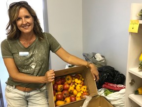 Steinbach Community Outreach (SCO) drop-in centre director Myra Gerbrandt is seen with produce that was donated to SCO. She said she hopes for more donations in the coming weeks and months as more people have been accessing their services and supports. Handout photo