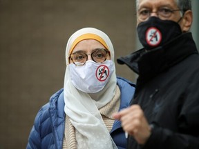 People attend a protest against Bill 21, after a court ruled that some teachers and provincial politicians are exempt from a controversial law that bans public employees from wearing religious symbols, in Montreal, Quebec, Canada April, 20, 2021.