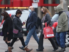 A group of people crossing a street in Winnipeg during the COVID-19 pandemic on Wednesday. Chris Procaylo/Winnipeg Sun