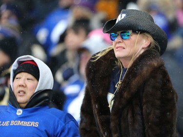 A Winnipeg Blue Bombers fan does not like what she sees in the first half in the CFL West Final against the  Saskatchewan Roughriders in Winnipeg on Sunday, Dec. 5, 2021.