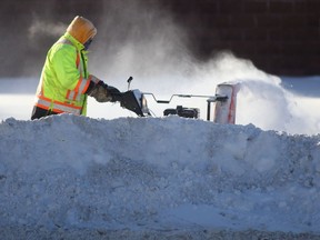 A person operates snow clearing equipment in Winnipeg on  Wednesday. Chris Procaylo/Winnipeg Sun