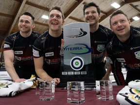 Lead Conner Njegovan, second Adam Casey, third Alex Forrest and skip Jason Gunnlaugson (from left) pose with the Viterra Championship trophy after beating Mike McEwen in the provincial men's curling championship final at Eric Coy Arena in Winnipeg on Feb. 9, 2020.
