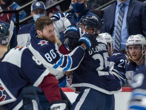 Colorado Avalanche right wing Logan O'Connor (25) goes after Winnipeg Jets left wing Pierre-Luc Dubois (80) after hitting Colorado Avalanche centre Nazem Kadri on the play during the second period at Ball Arena on Thursday.